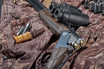 12-gauge hunting shotgun, binoculars and old duck call