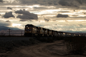 Train during sunset with moody, dark clouds. Matte printing for 11x14 or smaller