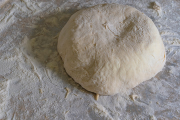 Making a pie with cheese and potato dough