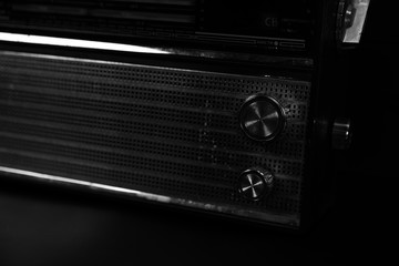 Old radio on wooden background