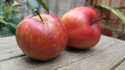 apples on a wooden table
