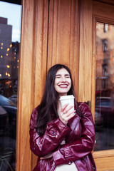 young pretty girl outside in city street with coffee happy smiling, lifestyle fashion peopple concept