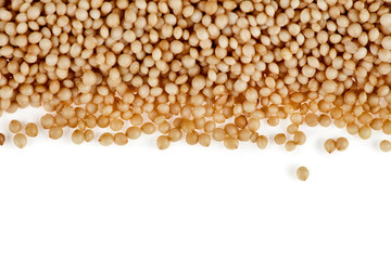 Border of amaranth seeds isolated on a white background. Top view.