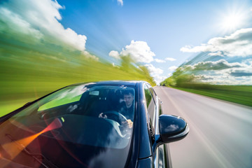 Driver point of view in car's windshield on countryside. Long Exposure blur shoot