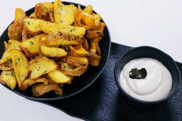 crispy fried potato chips or wedges with truffle cream dip