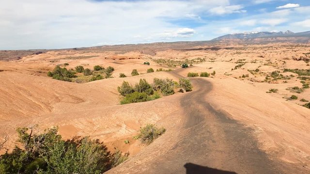 Moab Utah off road recreation red slick rock ATV. Desert. Tourists visitors worldwide visit Arches and Canyonlands National Parks. Recreation, 4x4 red slick rock trail climbing exploring.