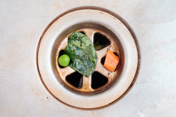 Sink sink clogged with vegetables