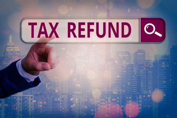 Conceptual hand writing showing Tax Refund. Concept meaning refund on tax when the tax liability is...