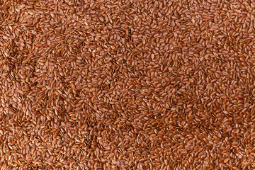 flax seeds as texture background, top view.