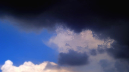 Naklejka na ściany i meble Storm clouds overtook the blue sky before the rain