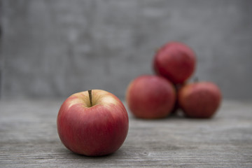 red apples on wooden table