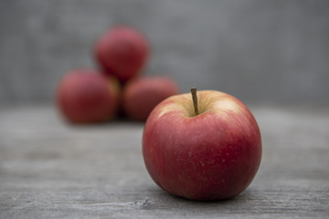 red apples on wooden table