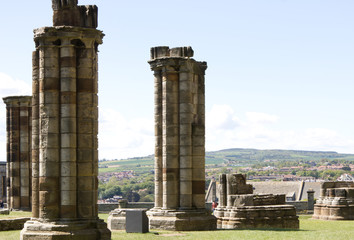 Pillars at  Whitby abbey ruins in north Yorkshire U.K. with blue sky in the background