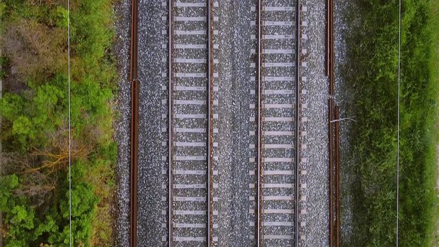 Flying over railway tracks, top view .