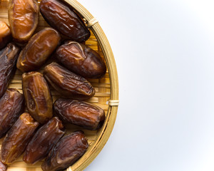 Dates or kurma on white background, the favorite food of the holy ramadhan month.