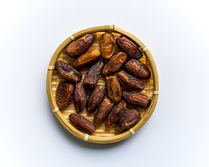 Dates or kurma on white background, the favorite food of the holy ramadhan month.