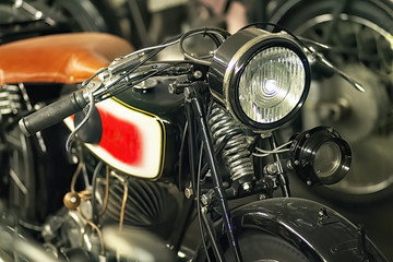 Fototapeta na wymiar Front, tank and lamp of a historic motorcycle