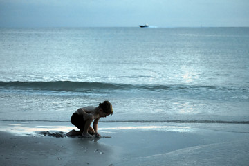 Child Playing at Beach