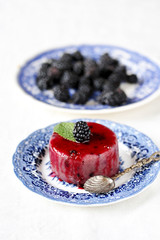 semolina pudding with blackberries. Soft focus. Copy Space