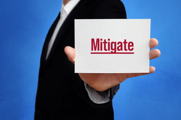 Mitigate. Lawyer holding a card in his hand. Text on the board presents term. Blue background. Law, justice, judgement