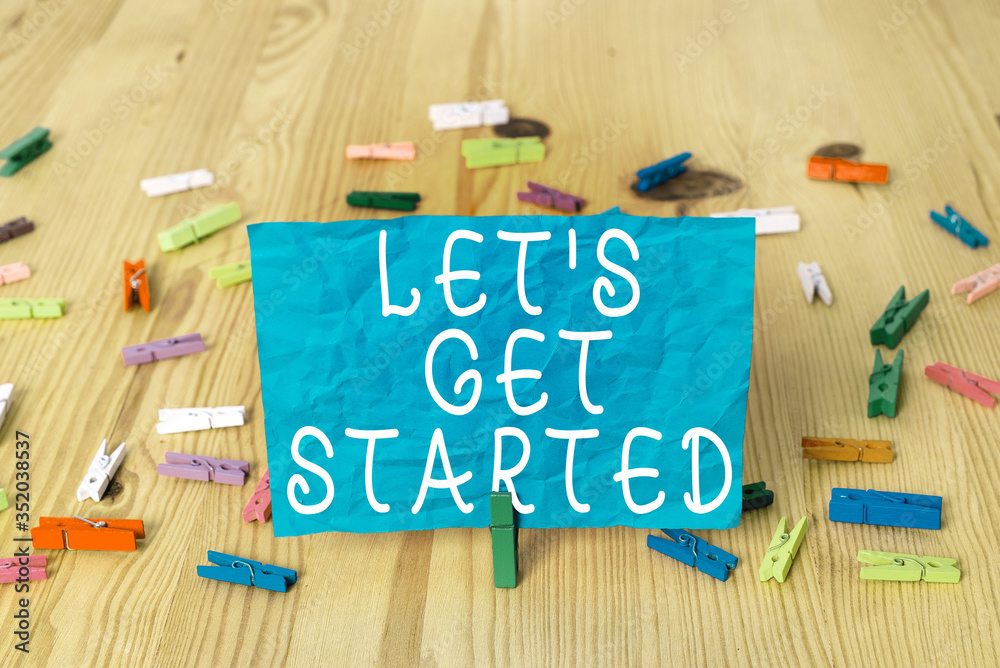 Wall mural writing note showing let s get started. business concept for encouraging someone to begin doing some