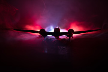 German Junker (Ju-88) night bomber at night. Artwork decoration with scale model of jet-propelled plane in possession.