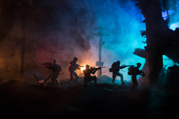 Fototapeta premium War Concept. Military silhouettes fighting scene on war fog sky background, World War Soldiers Silhouette Below Cloudy Skyline At night.