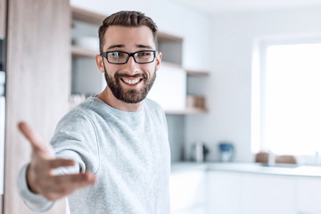 close up.young man standing in the kitchen