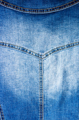 clothing items blue stonewashed faded jeans cotton fabric texture with seams, clasps, buttons and...