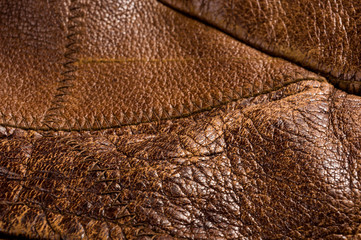 Old vintage genuine soft brown leather texture background, top layer with pores and scratches,...