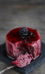 semolina pudding with blackberries.Soft focus.