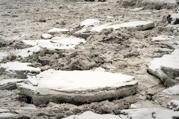 Close up of big pieces of ice (floes) breaking, cracking and melting in Knik Arm, north of Anchorage, Alaska. Winter landscape. Taken from Port of Anchorage Small Boat Launch. Coast of the city.