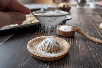 Arabic filled Pistachio Maamoul Cookies  on top powdered sugar ,top view preparation and ingredients
