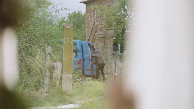 POV of a neighbour seeing a kidnapper taking out the child from the blue ven. Child abduction scene