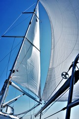 Fototapeta premium Sail tack with a sailing yacht in the wind with blue sky.