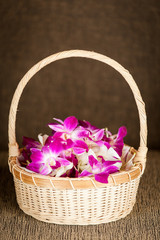 A Basket flower waiting for flower girl to hold and walk leading  the bride to the aisle for wedding ceremony