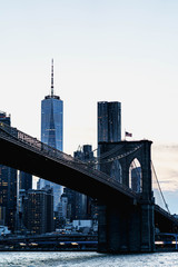 New York night panorama. Brooklyn Bridge and New York City skyline. Manhattan skyline. Skyscrapers buildings. New York City night lights. 