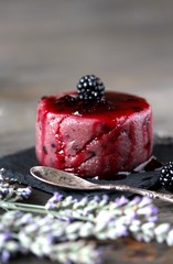 semolina pudding with blackberry and lavender watered with berry syrup