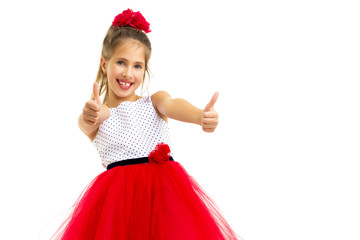 Little girl holding her thumb up