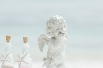 Wedding rings close up decorated nautical with accessories for tropical caribbean outdoor wedding ceremony on the sandy beach in Dominican republic, Punta Cana