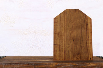 background Image of vintage table in front of old white decorative wooden wall. ready for product display