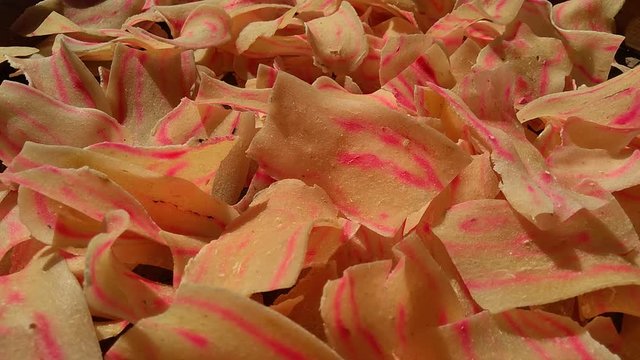 Raw cassava chips. Indonesia (Javanese) called it as opak telo. Traditional chips made off cassava. The taste is crunchy, savory, tasteful and delicious.