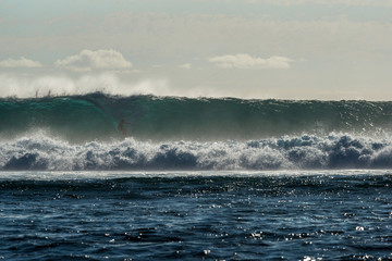 Kiter rides big waves on the island of Mauritius, Indian Ocean