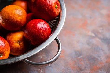 Ripe bloody oranges on the rustic background. Selective focus. Shallow depth of field.
