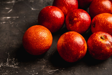 Ripe bloody oranges on the rustic background. Selective focus. Shallow depth of field.
