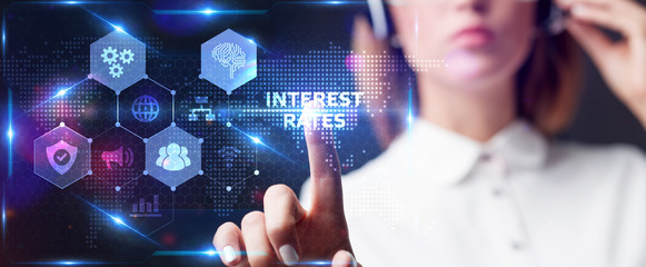 Businessman presses button  interest rates on virtual screens. Business, Technology, Internet and...