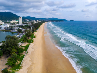 Aerial view of quiet Karon beach in Phuket Thailand during locked down policy due to Covid-19. All beaches in Phuket are not allowed to enter. © 9mot
