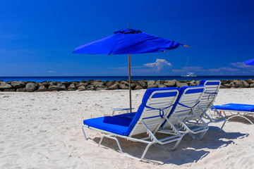 beach chairs and umbrella on the beach