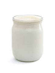 Georgian matsoni yoghurt in a glass pot isolated on white background