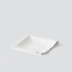 white napkin on light grey background